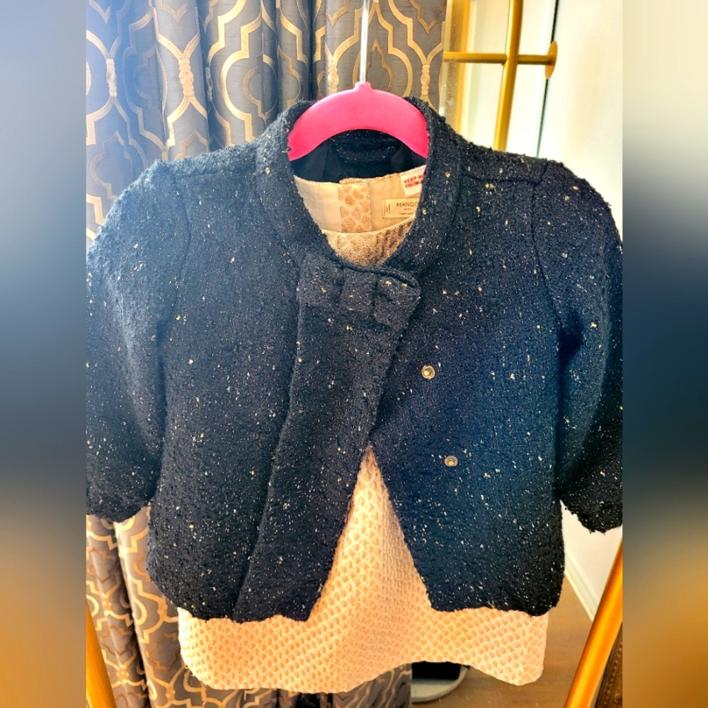 Black tweed material with gold accent baby jacket.